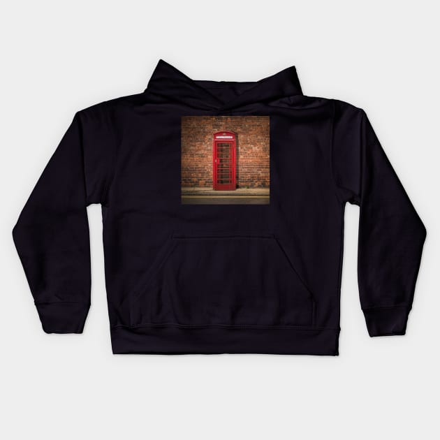 British Phone Box Against Red Brick Wall Kids Hoodie by mrdoomits